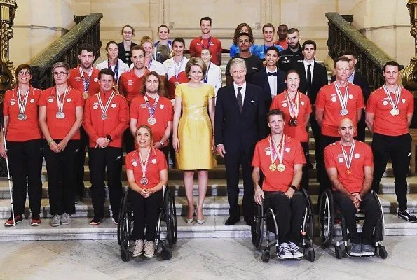 Queen Mathilde held a reception at the Royal Palace to congratulate the athletes that won medals. Mathilde wore a yellow dress by Natan fashion hause