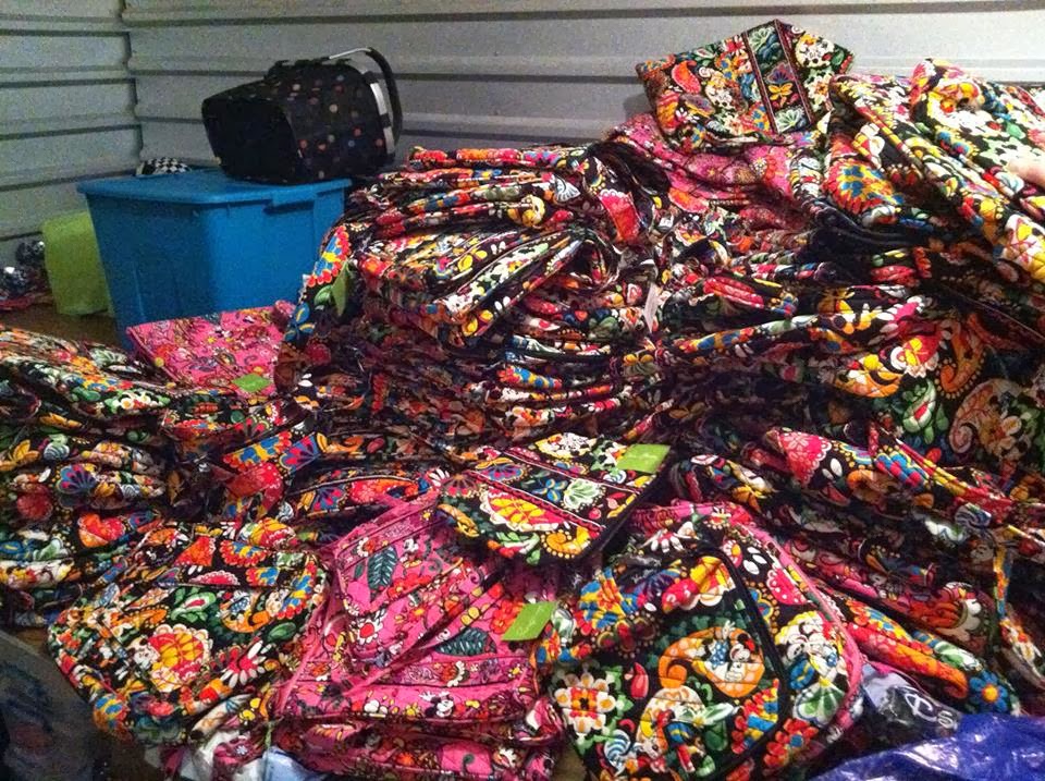 the pile of vera bags that we bought to fill orders and there are bags ...