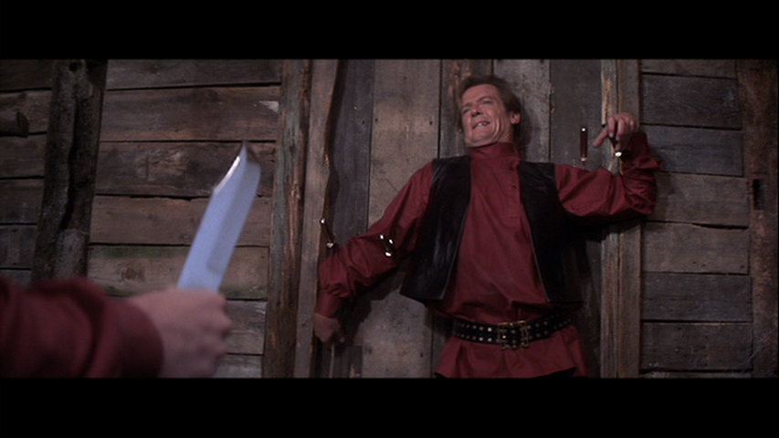 Octopussy-James-Bond-Roger-Moore-knife-thrower.png