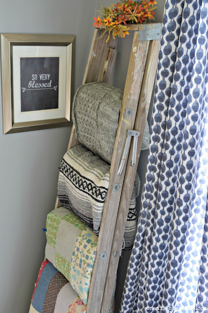 Trash to treasure: old and worn step ladder turned into a beautiful rustic blanket ladder