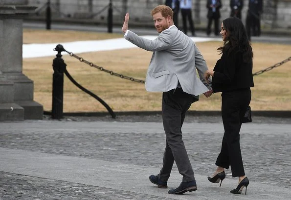 Meghan Markle wore Givenchy black cropped double-breasted blazer and trousers, Sarah Flint Pumps, she carried Givenchy GV3 frame clutch bag