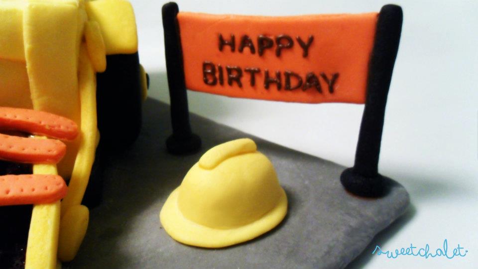 Construction accessories, helmet and road sign made of fondant