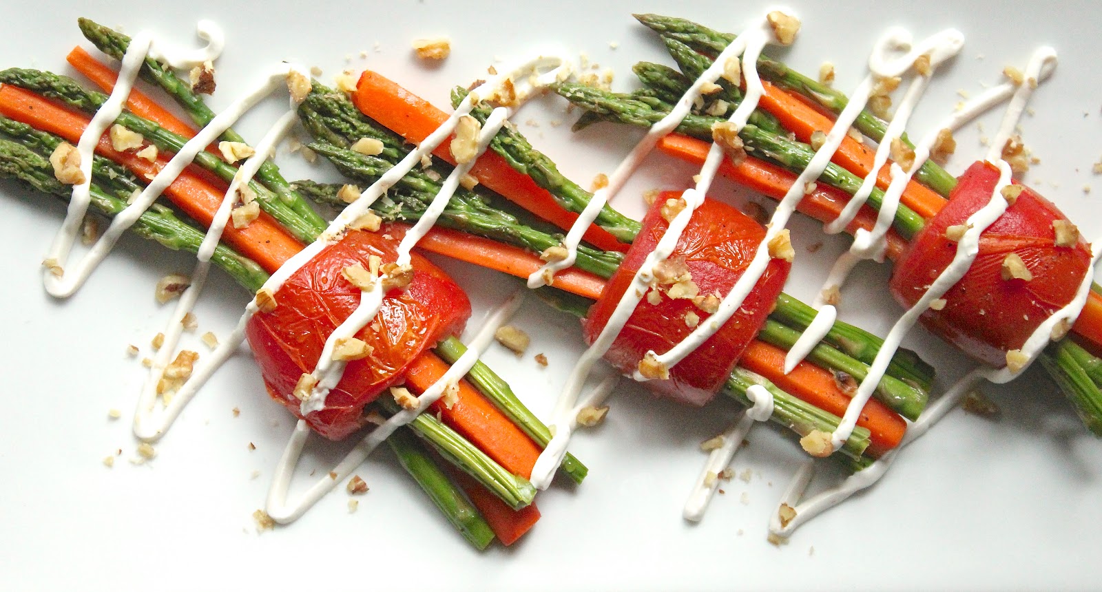 ROASTED ASPARAGUS CARROT BUNDLES WITH WALNUTS AND GOAT CHEESE DRIZZLE