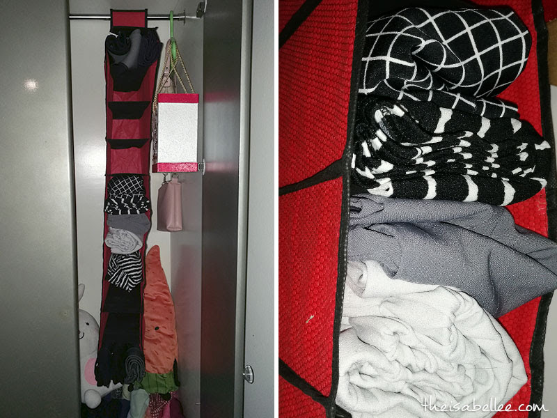 Using a hanging organiser to arrange wardrobe