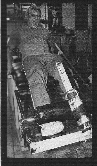 Tom Platz extensora deitado Homem fazendo exercicio