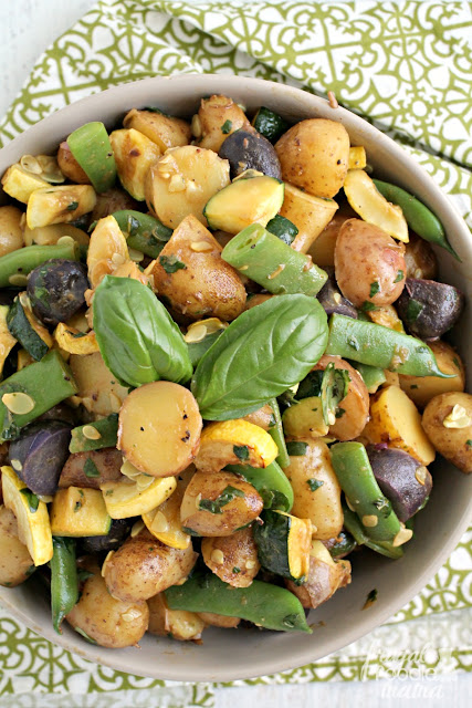 The freshest locally grown potatoes & veggies come together perfectly with a super simple 3 ingredient fresh basil dressing in this Summer Harvest Potato Salad.