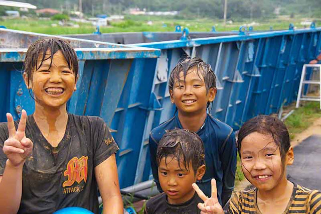 Children at a mud festival