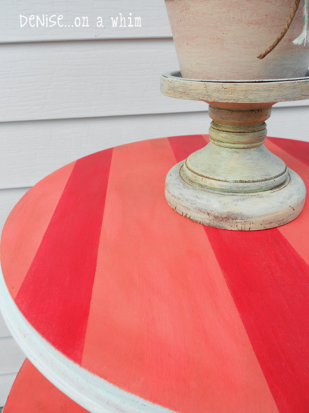 Coral with red stripes add a touch of whimsy to a roadside rescue table from Denise on a Whim