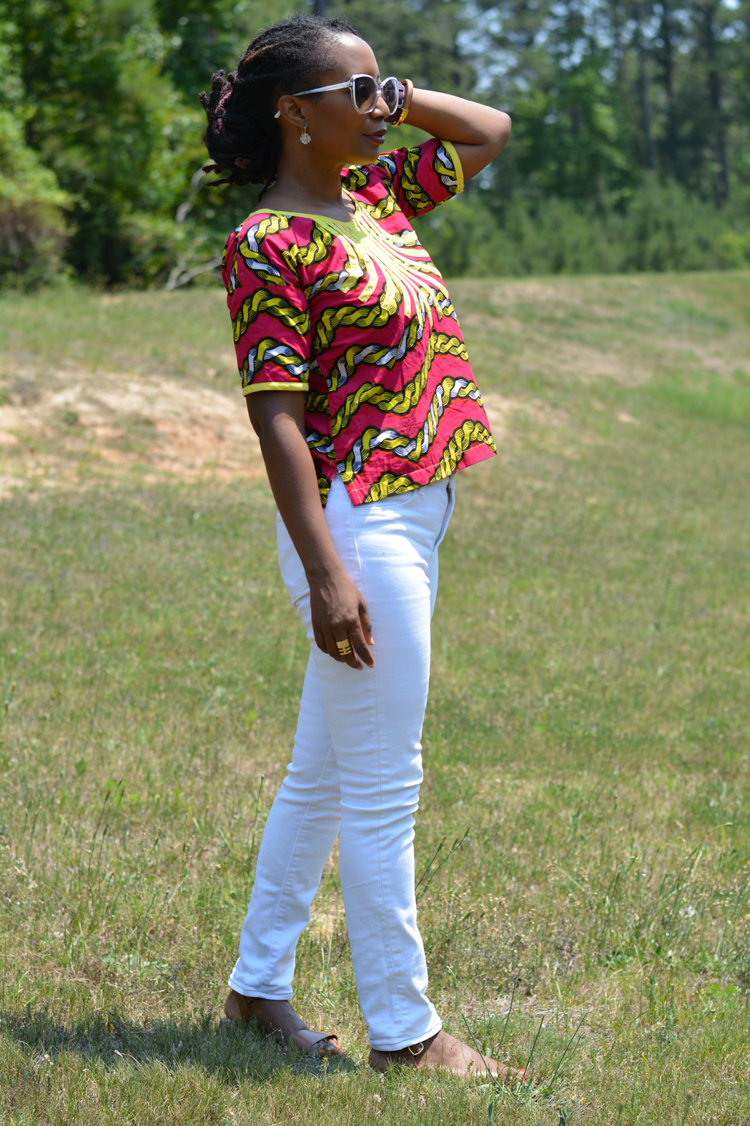 african print top worn with white jeans