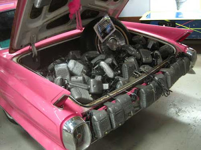 Pink Cadillac trunk full of metal radios