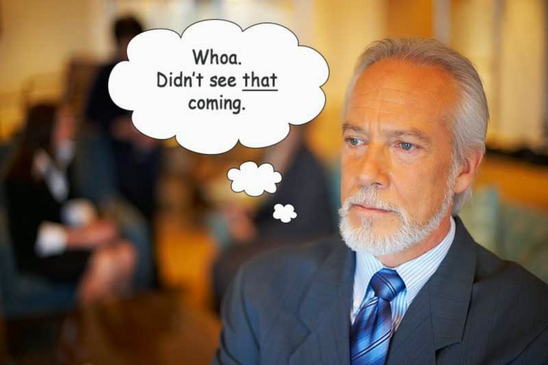 A man with gray hair in a suit with a thought bubble containing the text, "Whoa. Didn't see that coming."