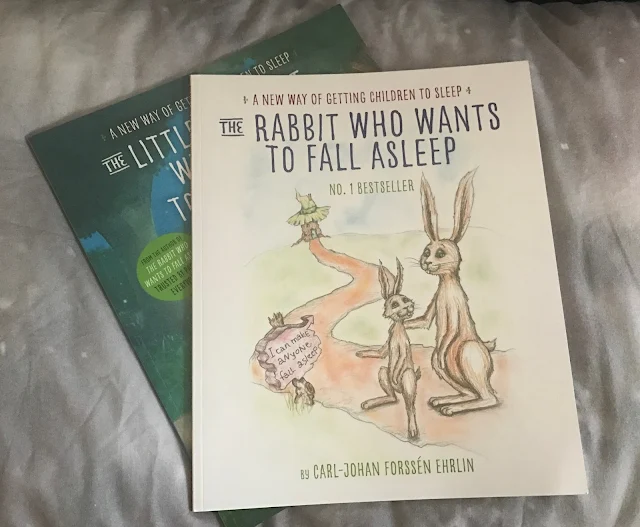 2 books (The Rabbit Who Wants To Fall Asleep and The Little Elephant Who Wants To Fall Asleep by Carl-Johan Forssen Ehrlin) on a grey pillow