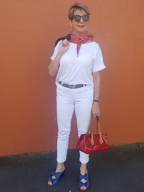 White outfit with bright accessories