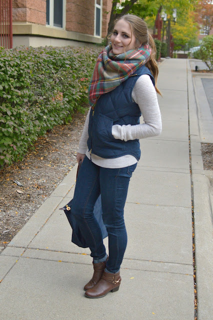 navy puffer vest with a blanket scarf