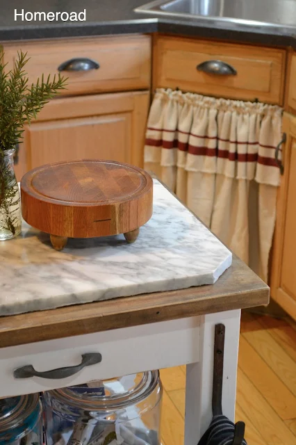 Cutting board with skirted sink in background