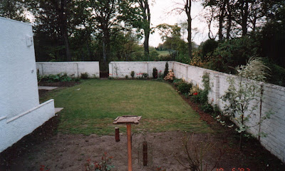 lawn and border and hole in back wall