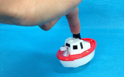 Clockwork toy motor boat