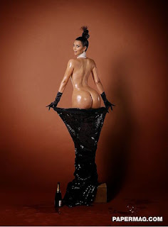 Kim Kardashian rising naked out of a dress for PaperMag.com
