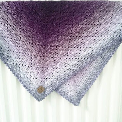 crochet blanket made with superfine yarn
