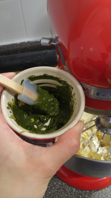 A small bowl containing matcha paste made by adding hot water to the matcha powder.