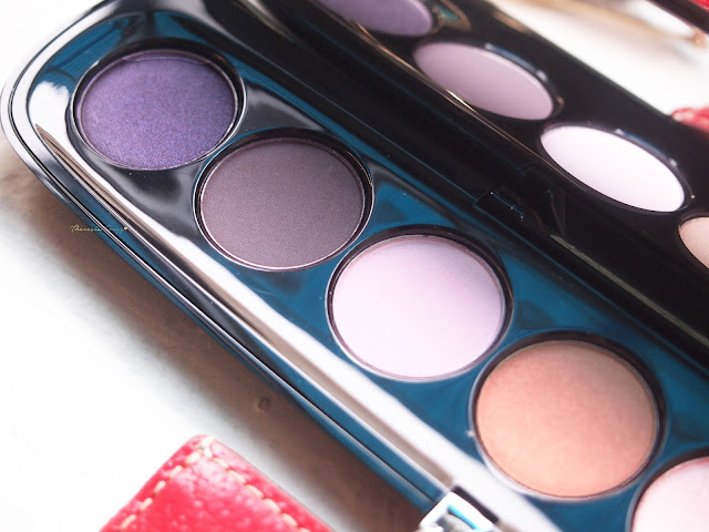 Marc Jacobs Beauty The Tease (202) Style Eye-Con No. 7 Plush Shadow Palette with seven eyeshadows in a purple theme.