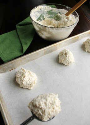 bowl of biscuit dough and mounds of yogurt biscuit dough on baking sheet