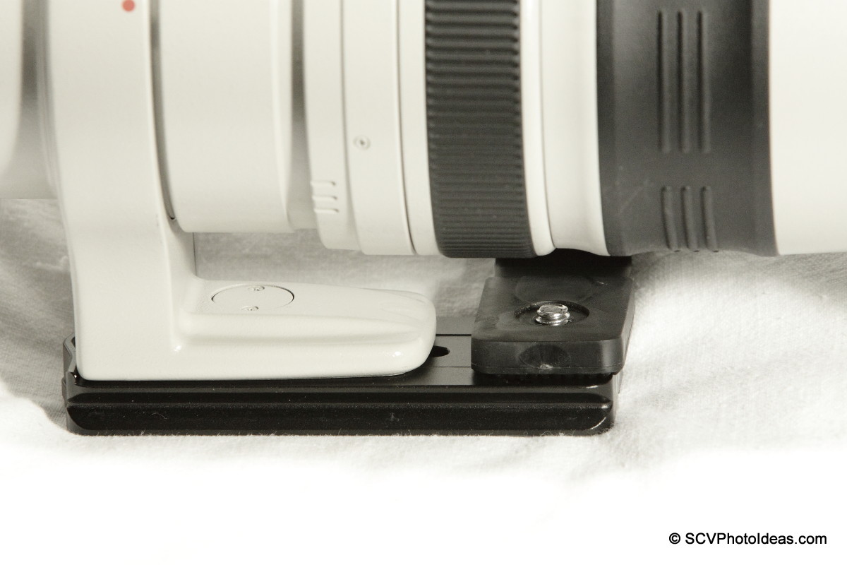 Boling C-Shape Flash Bracket screwed on LP-100 lens plate -top