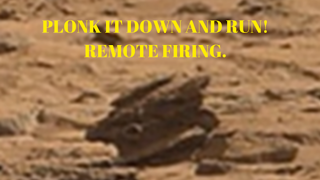 What looks like a tank turret on Mars with gun in tact. What looks like a tank turret on Mars with gun in tact.