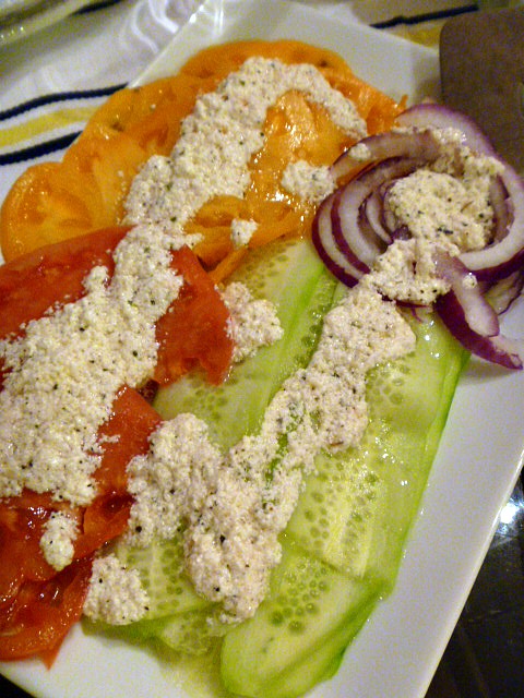 Go Greek! Tomato Cucumber and Onion Salad with Feta Vinaigrette: Heirloom tomatoes that are bursting with flavor and topped with a light feta dressing!