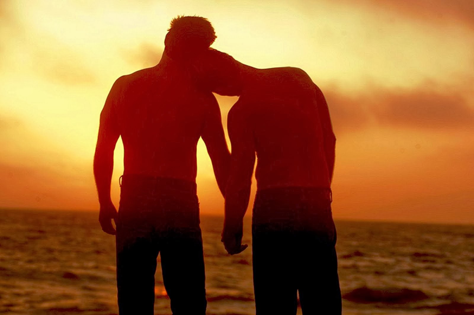 [Image: two-men-on-the-beach-at-sunset-holding-hands.jpg]