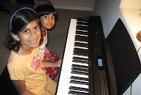 Why kids should play piano - azpianonews.com girls playing piano
