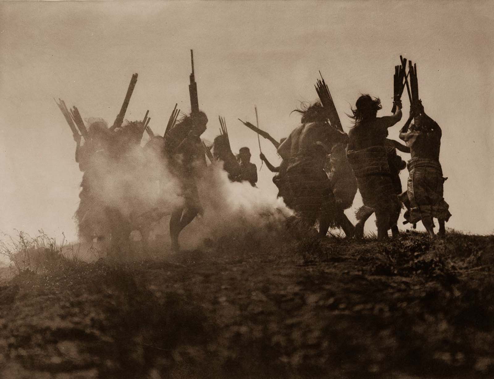 Members of the Qagyuhl tribe dance to restore an eclipsed moon. 1910.