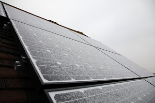 Frosty solar panels in winter