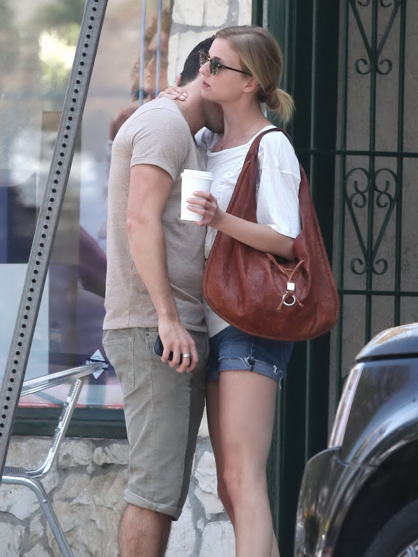 Emily VanCamp and Josh Bowman showing some affection on the street