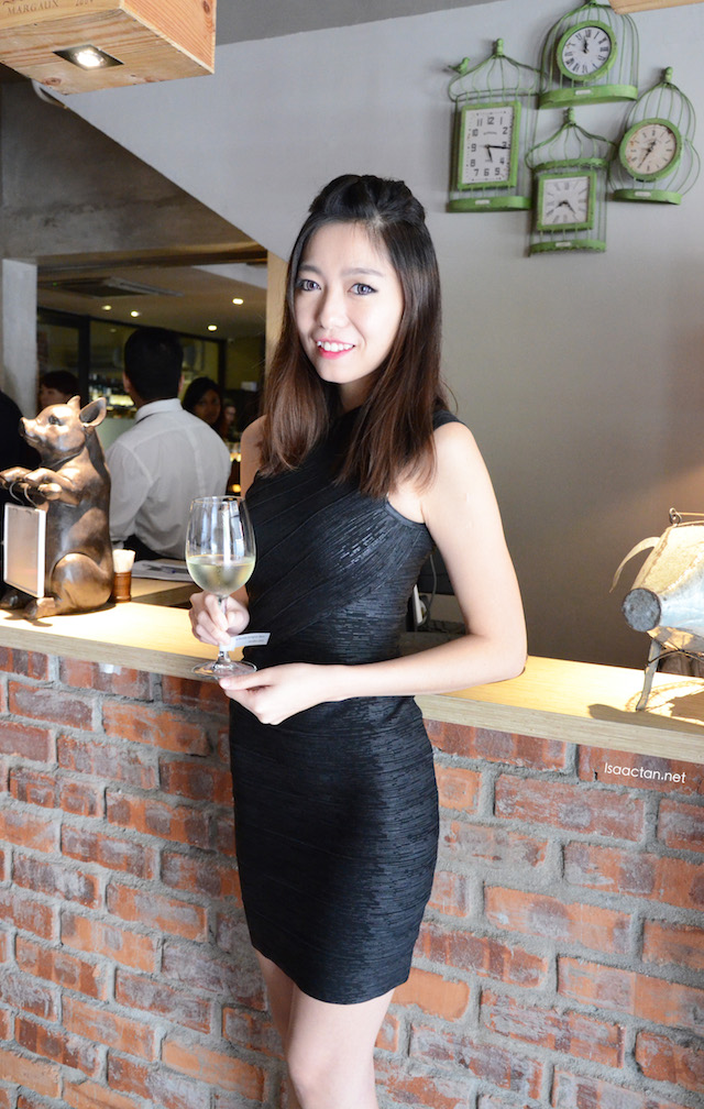 Welcome to an afternoon of food and wine pairing, says the pretty lady in black Welcome to an afternoon of food and wine pairing, says the pretty lady in black