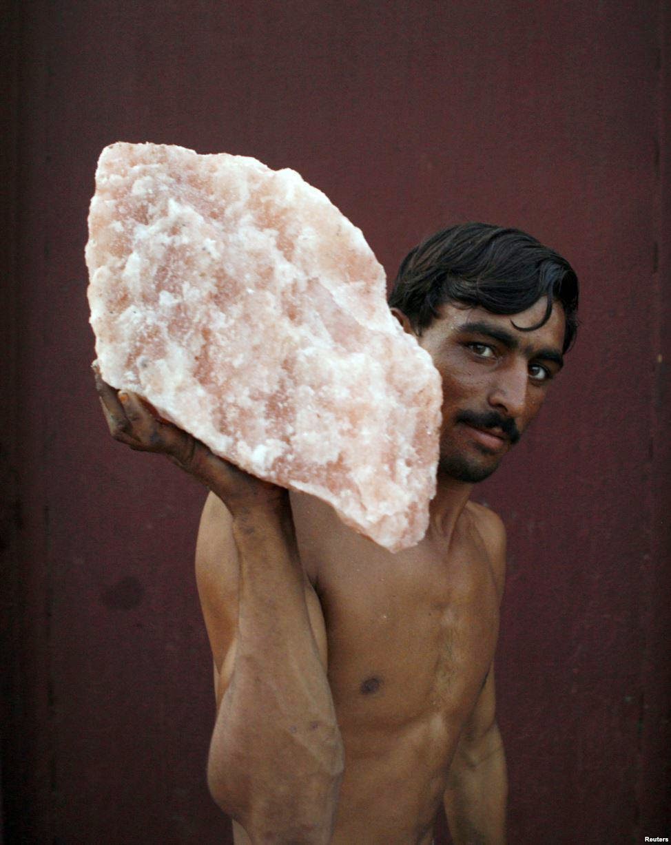 Pink Salt (often mined in Pakistan) A laborer, carrying rock salt-5 Best Places To Discover In Pakistan Pink Salt (often mined in Pakistan) A laborer, carrying rock salt 5 Best Places To Discover In Pakistan