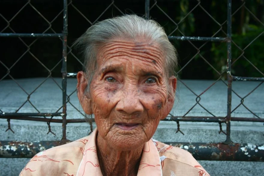 An old lady inside Manila North Cemetery