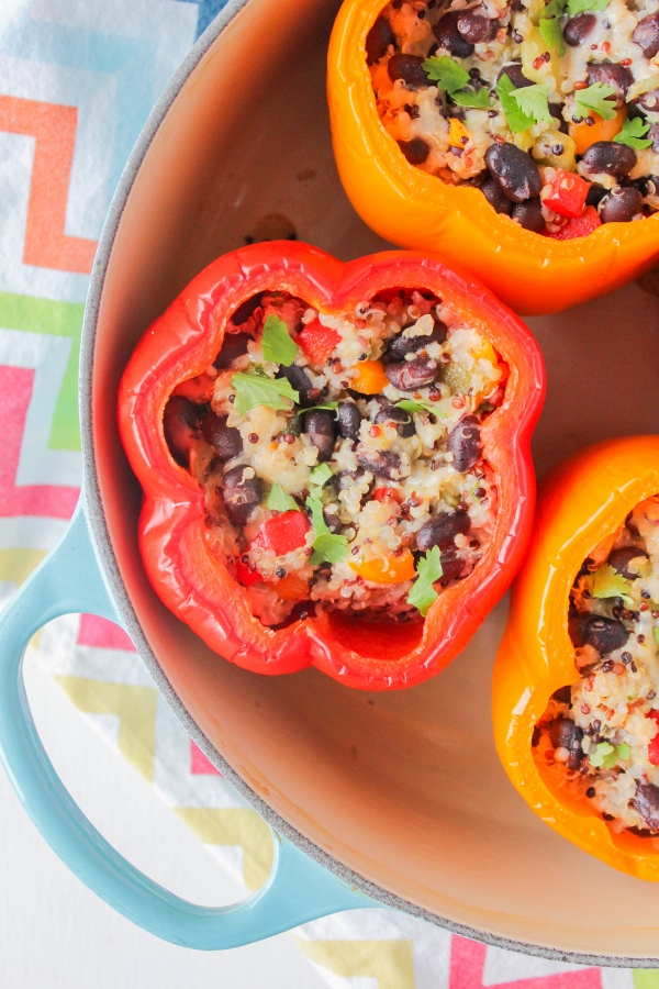 Simple Mexican Quinoa and Black Bean Stuffed Peppers are full of protein, fiber, and plenty of flavor! This is a healthy and well-balanced meal that the whole family will love.