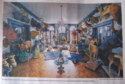 View of a large ornate sunroom with dozens of dead animals standing on the floor and mounted on the walls