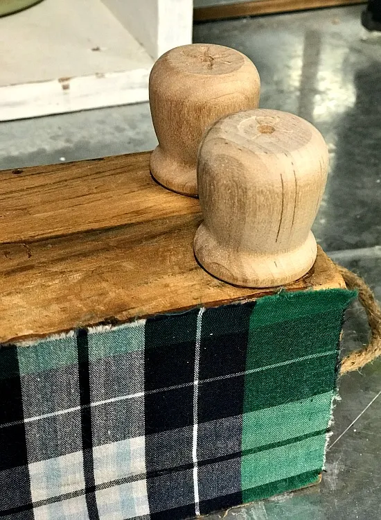 Candle cup feet on bottom of crate