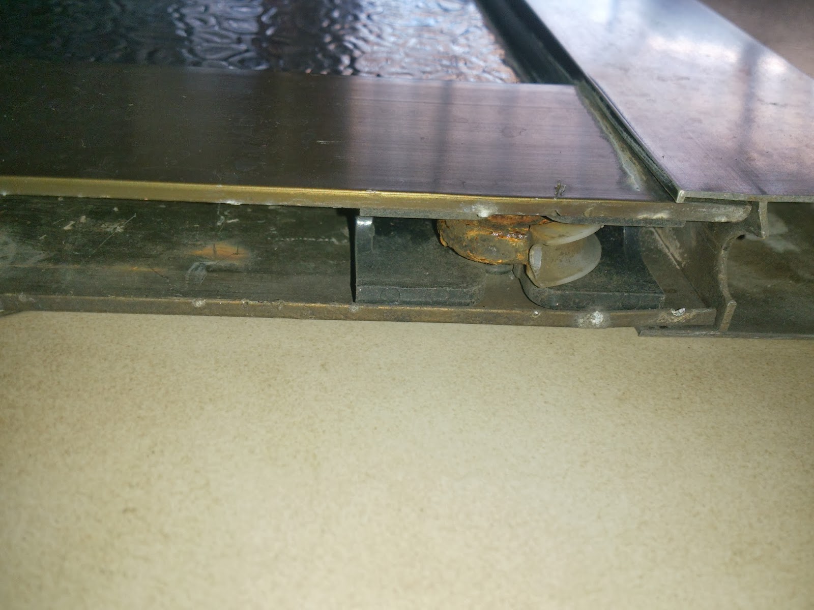 How to repair a stuck sliding glass door by changing the wheel parts