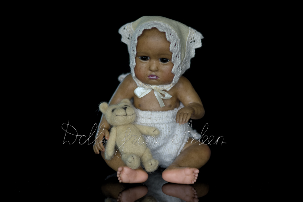 OOAK baby girl doll holding her teddy bear