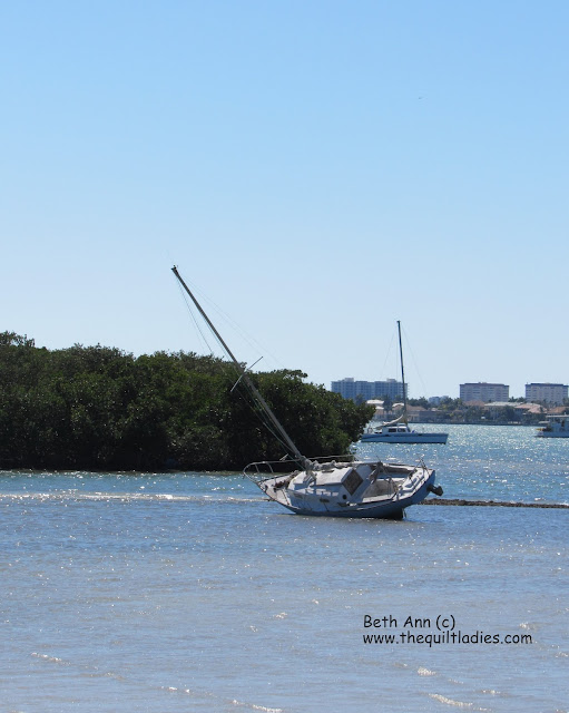 Sale boat on the beach by Beth Strub