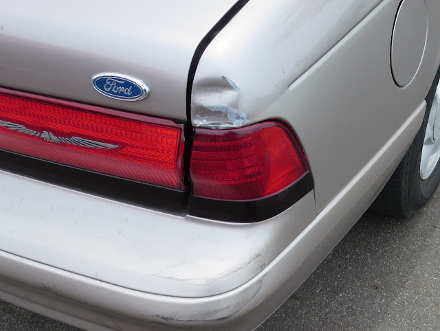 Dented quarter panel and misaligned trunk on Thunderbird before repairs at Almost Everything Auto Body