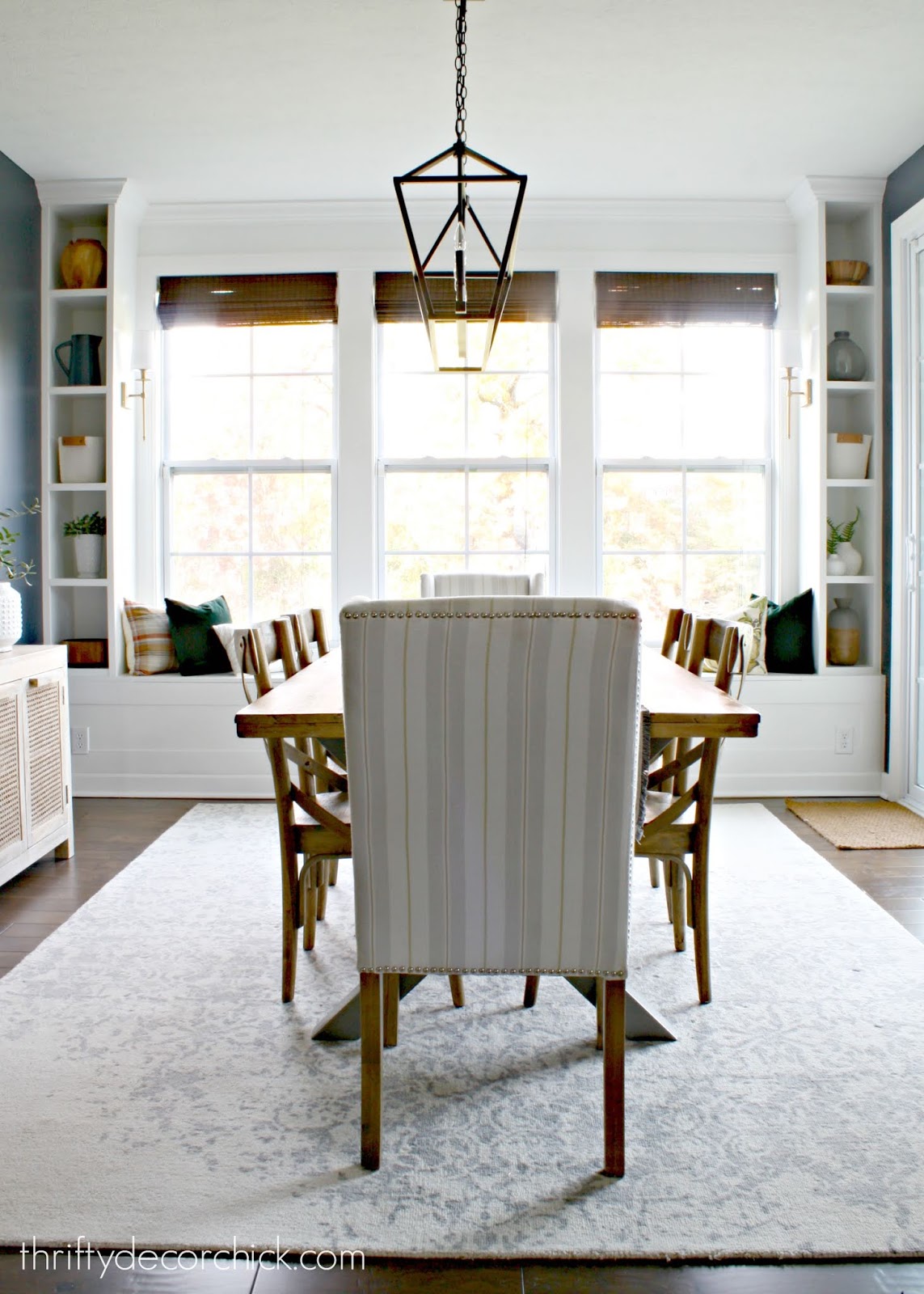 DIY built in unit around windows with seat and bookcases