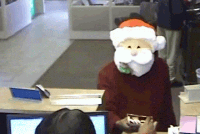 "Papai Noel" distribui presentes em banco, e depois assalta! ~ O Lado