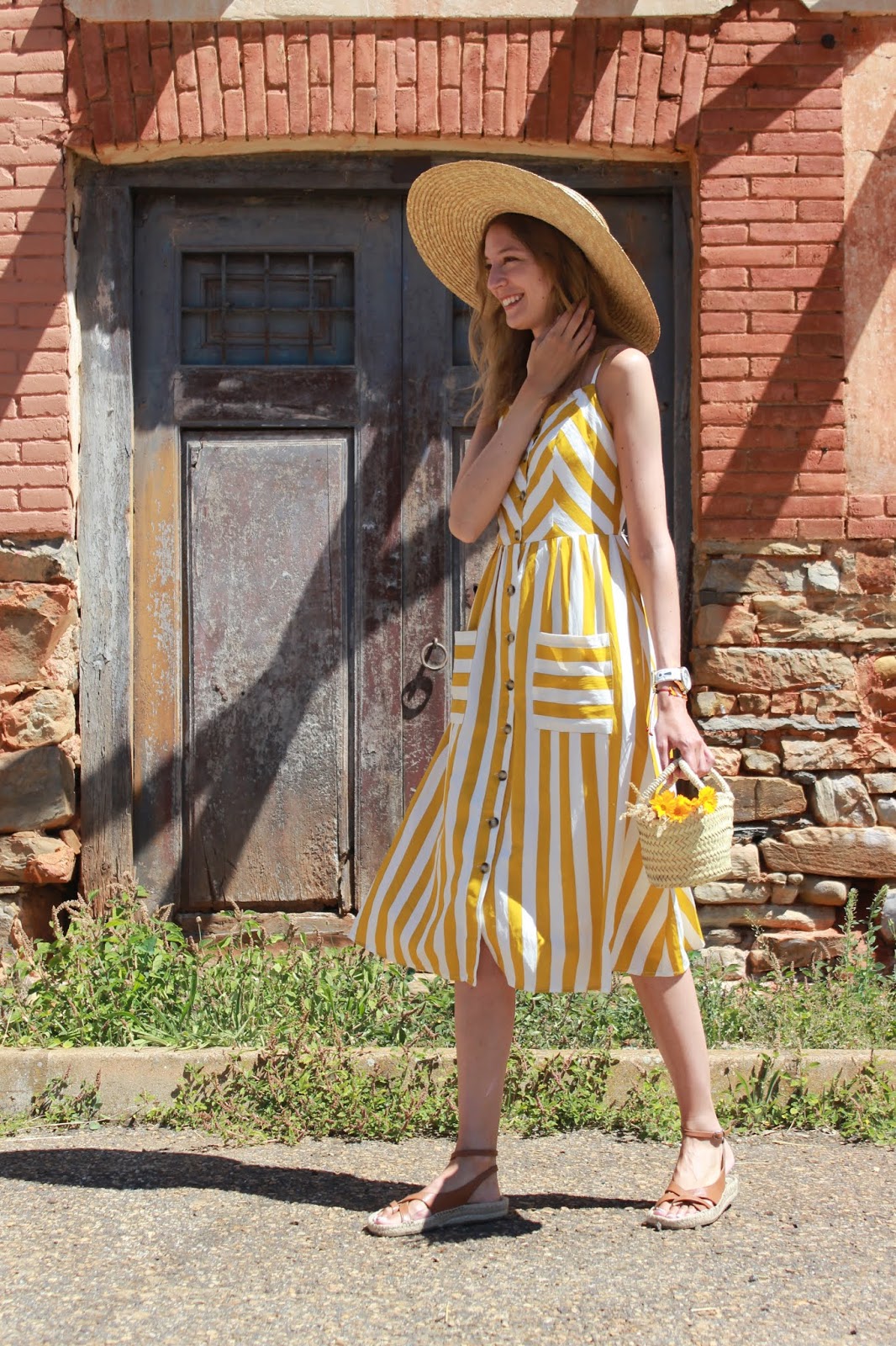 yellow-stripes-midi-dress-straw-hat-straw-bag-leather-espadrilles