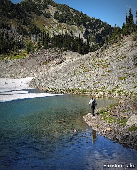 hiker glacier tarn