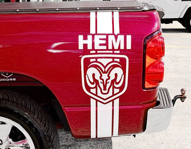 white-hemi-and-dodge-logo-stripe-on-bedside-of-red-dodge-ram-truck