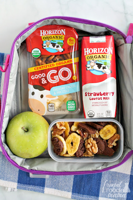 This Chunky Monkey Snack Mix is a crunchy mix of whole wheat chocolate grahams, organic banana chips, & satisfying walnuts. It is sure to quickly become a lunchbox & after school snack favorite.